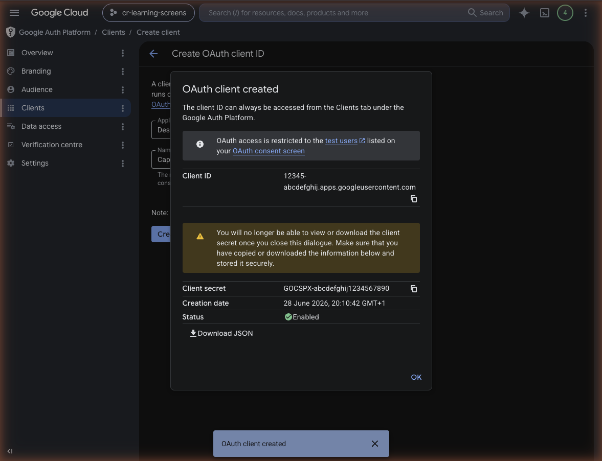 OAuth client created dialog showing the Client ID and Client secret strings ready to copy with a warning that the secret cannot be viewed after closing